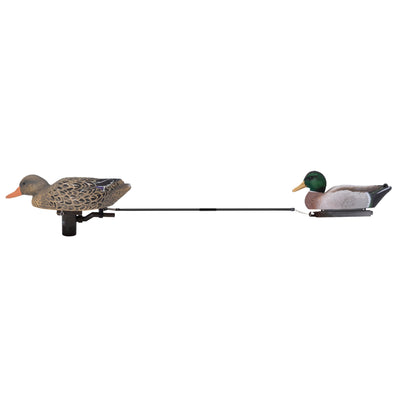 The Higdon Outdoors PRO Swimmer Trailing Rod connects a female mallard decoy on the left and a male mallard decoy on the right with a long, black rod, ideal for hunting or bird watching.
